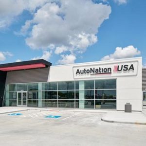 automotive cover image for epperson company projects page showing white building with large windows and signage that reads auto nation usa