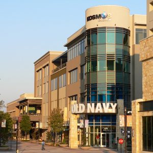 restaurant and retail cover image for epperson company projects page showing retail space shopping center with old navy sign evening shot real estate management