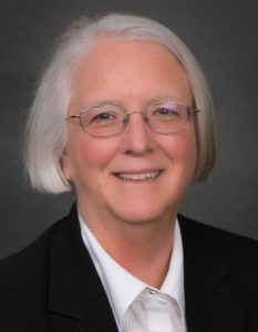 a sue jones director of construction at epperson company woman with short gray hair glasses smiling team member
